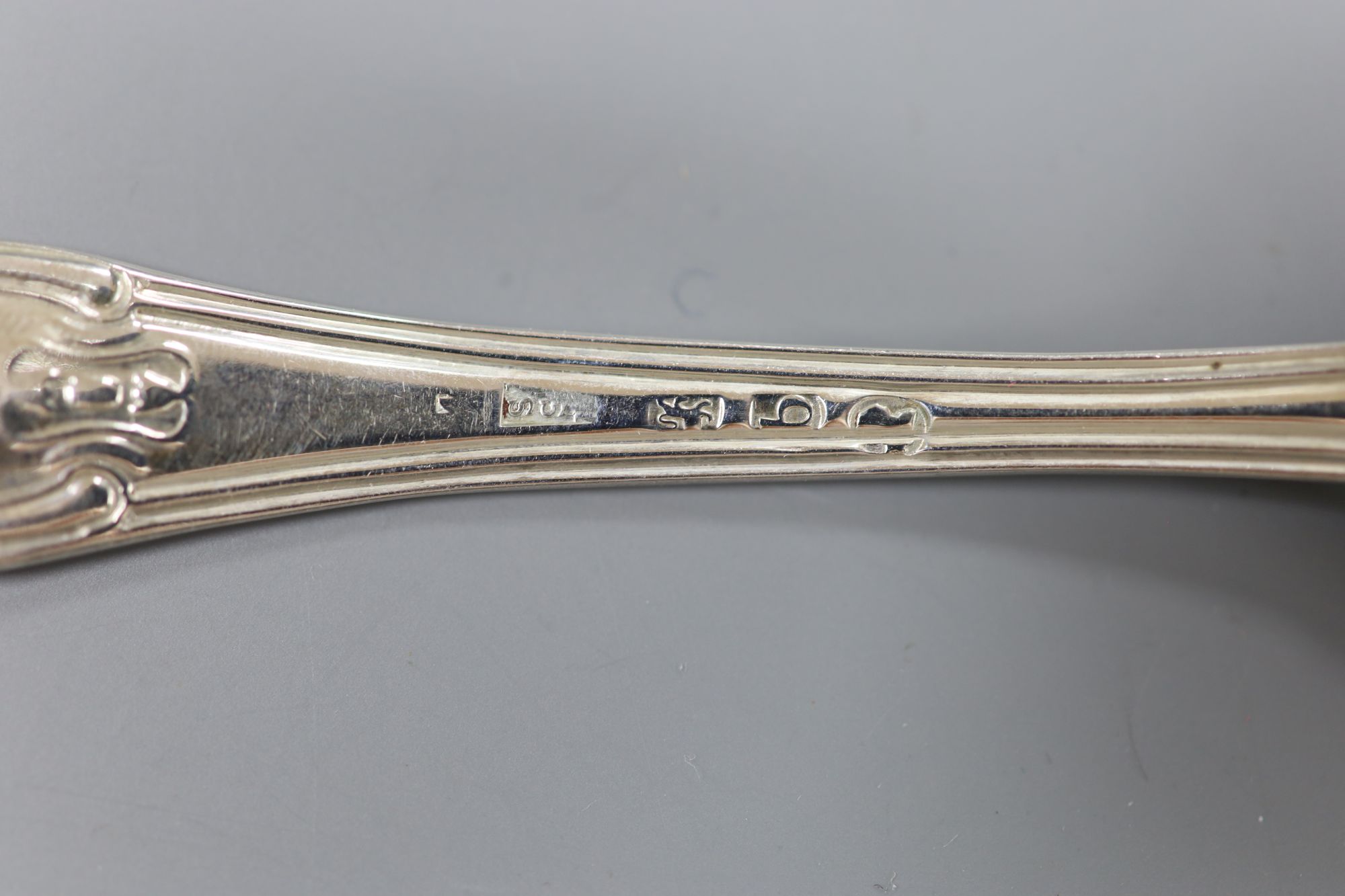 A matched set of twelve George III silver hourglass pattern teaspoons, various makers, London, 1817/8, 11oz.